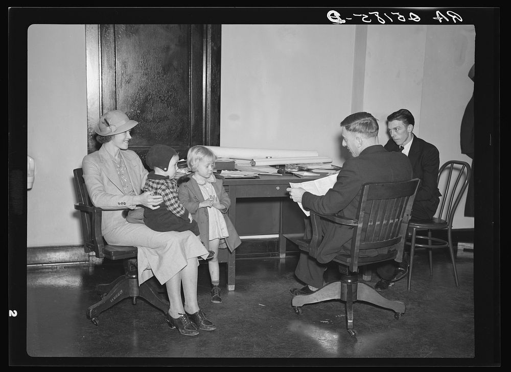 Interviewing applicants for homesteads at resettlement office in Birmingham, Alabama. Sourced from the Library of Congress.