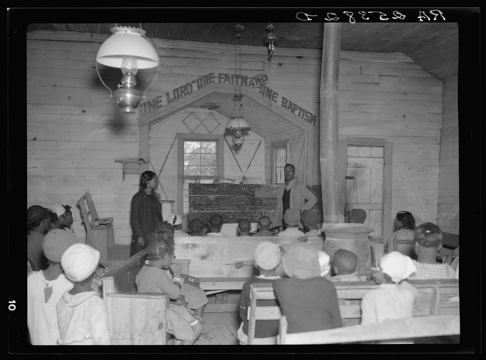 Conducting school in a church at Gees Bend, Alabama. Sourced from the Library of Congress.