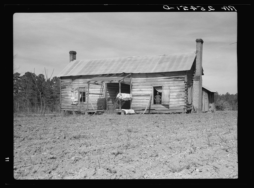 Dog-run house inhabited by  tenant farmer. Montgomery County, Alabama. Sourced from the Library of Congress.