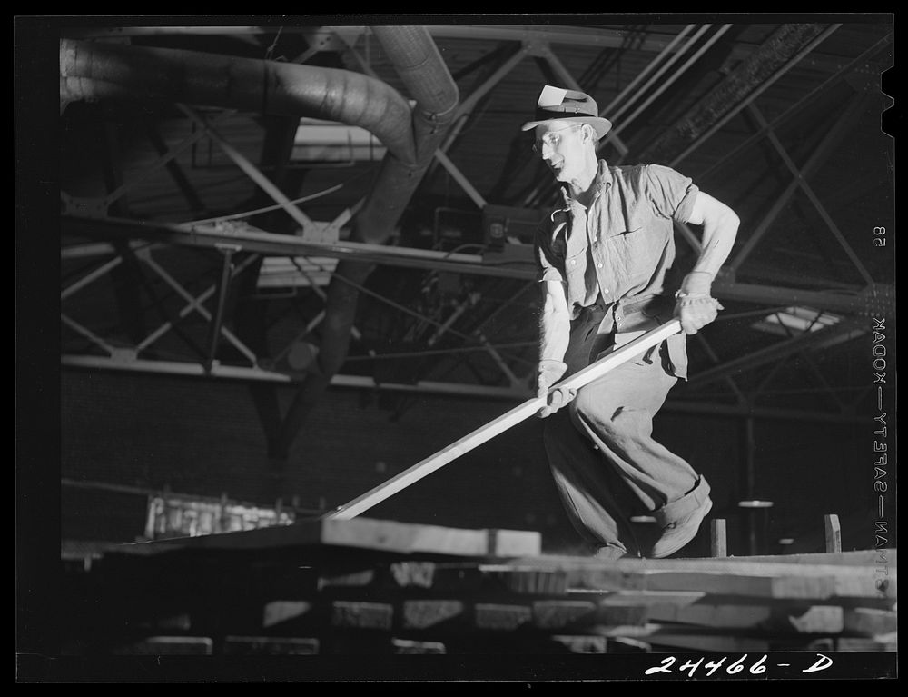 [Untitled photo, possibly related to: Worker on lumber stacks. Dimension lumber plant. Dailey, West Virginia]. Sourced from…