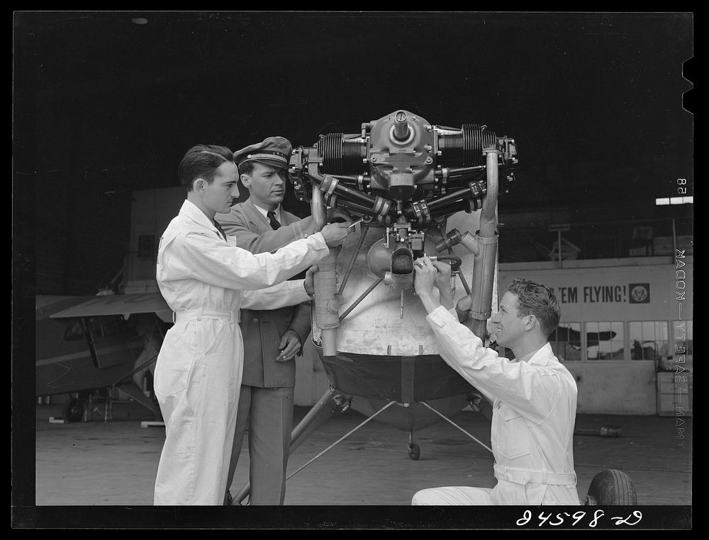 Students working on airplane motor at civilian pilot training school. Meacham Field, Fort Worth, Texas. Sourced from the…