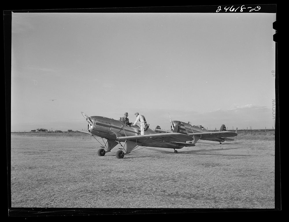 [Untitled photo, possibly related to: Fort Worth, Texas. Meacham Field. Student wheeling a plane into position]. Sourced…