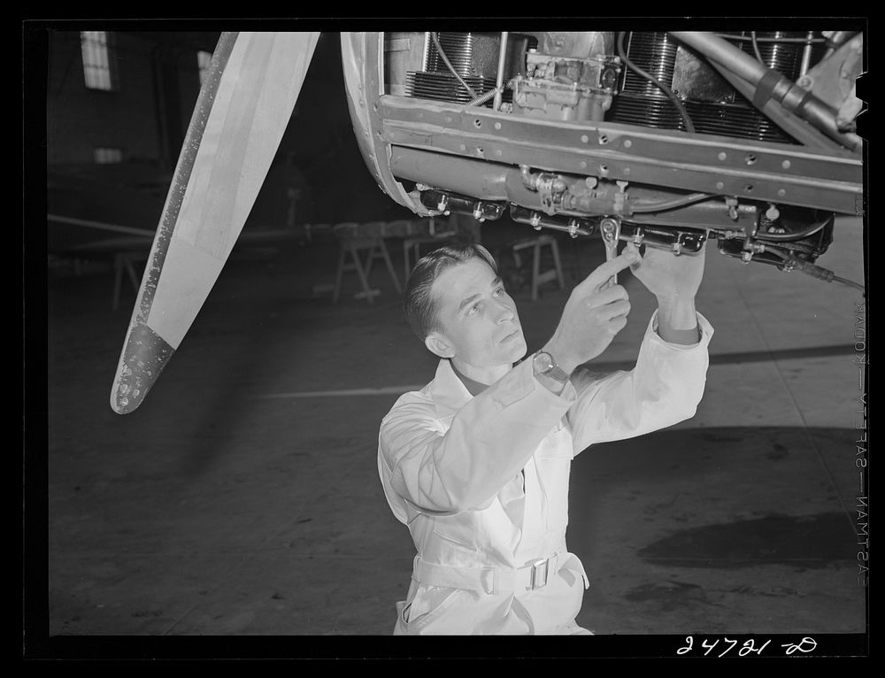 Fort Worth, Texas. Meacham Field. Student working on motor. Sourced from the Library of Congress.