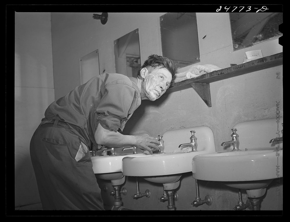 Farm worker in bathhouse. Robstown camp, Texas. Sourced from the Library of Congress.