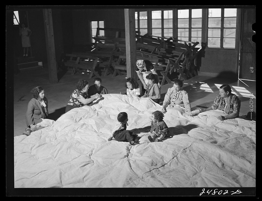 [Untitled photo, possibly related to: Women's committee works on mat for athletics. FSA (Farm Security Administration) camp…