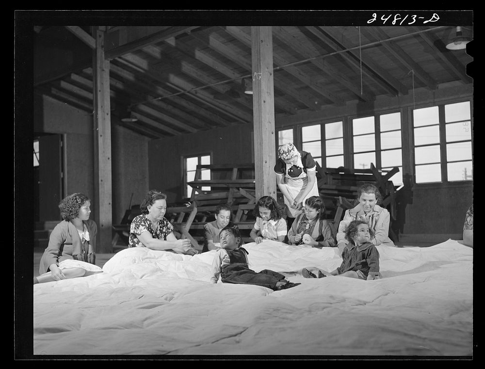 Women's committee works on mat for athletics. FSA (Farm Security Administration) camp, Robstown, Texas. Sourced from the…
