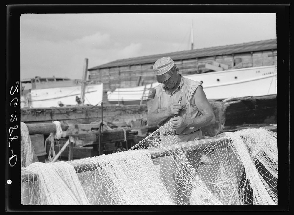 Fisherman mending his net. Key West, Florida. Sourced from the Library of Congress.