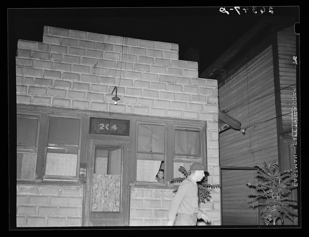 Man leaving prostitute's house. Peoria, Illinois. Sourced from the Library of Congress.
