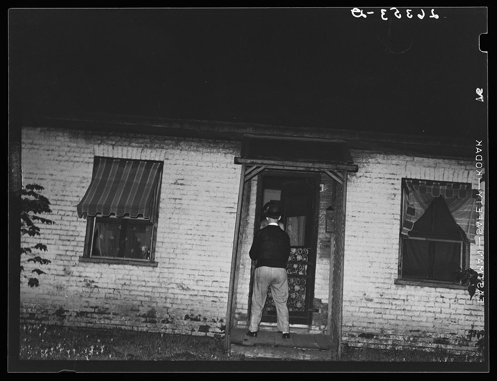 Man about to enter prostitute's house. Peoria, Illinois. Sourced from the Library of Congress.