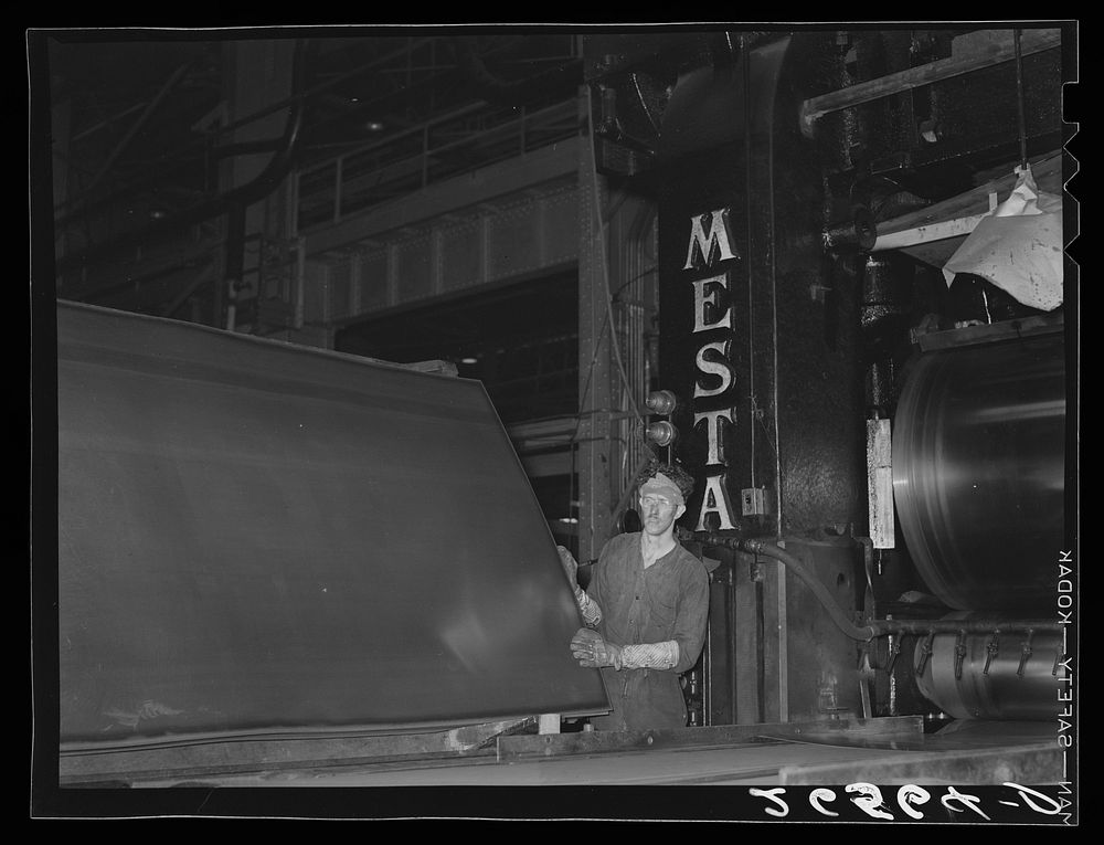 Examining sheets of steel after rolling. Pittsburgh, Pennsylvania. Sourced from the Library of Congress.