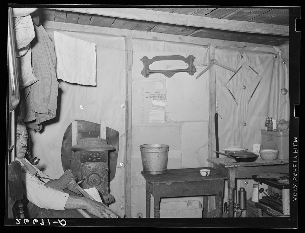 [Untitled photo, possibly related to: Agricultural worker in one-room shack. Burlington County, New Jersey]. Sourced from…