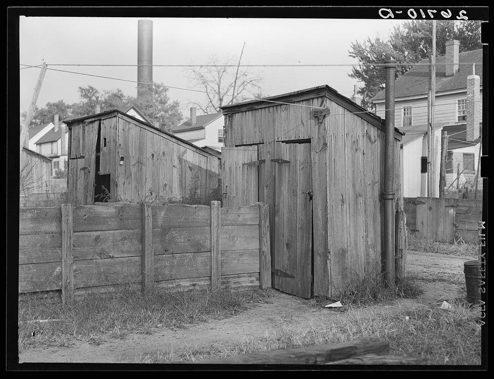Toilets behind mill worker's houses. Millville, New Jersey. Sourced from the Library of Congress.
