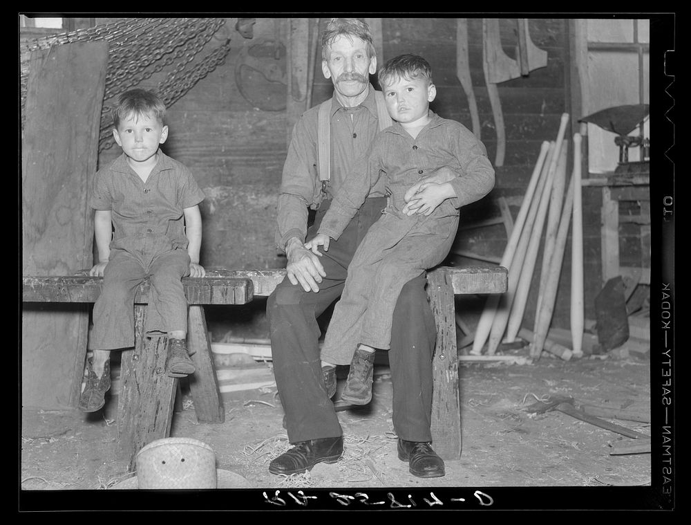 French-Canadian inhabitant of Lowell, Vermont, and his grandchildren. Sourced from the Library of Congress.