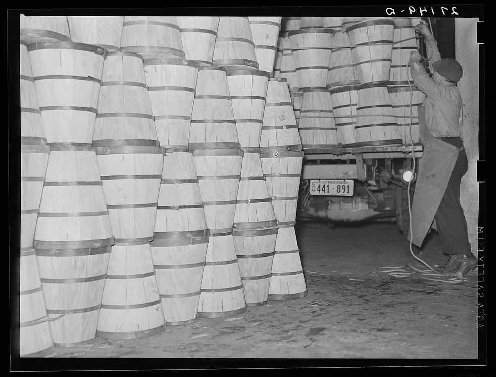 Loading crates of cabbages at produce market. Pier 29. New York City. Sourced from the Library of Congress.