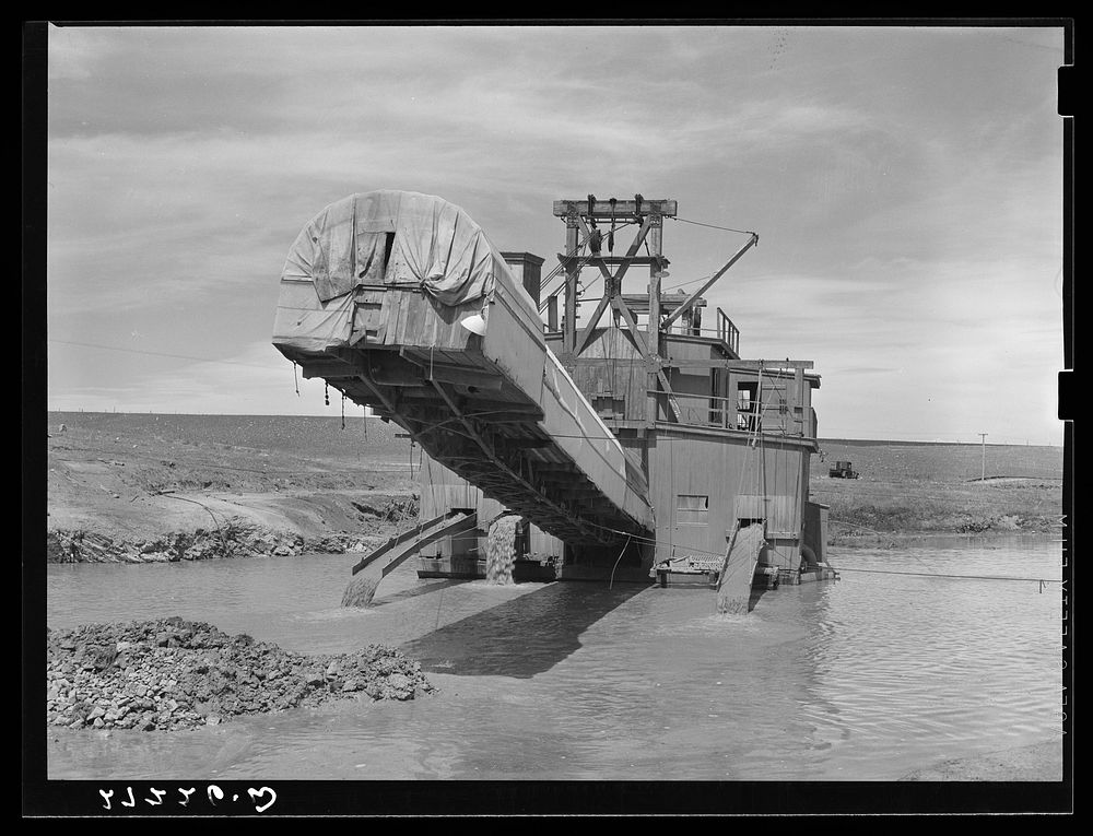 Dredge used in placer gold mining. Madison County, Montana. Sourced from the Library of Congress.