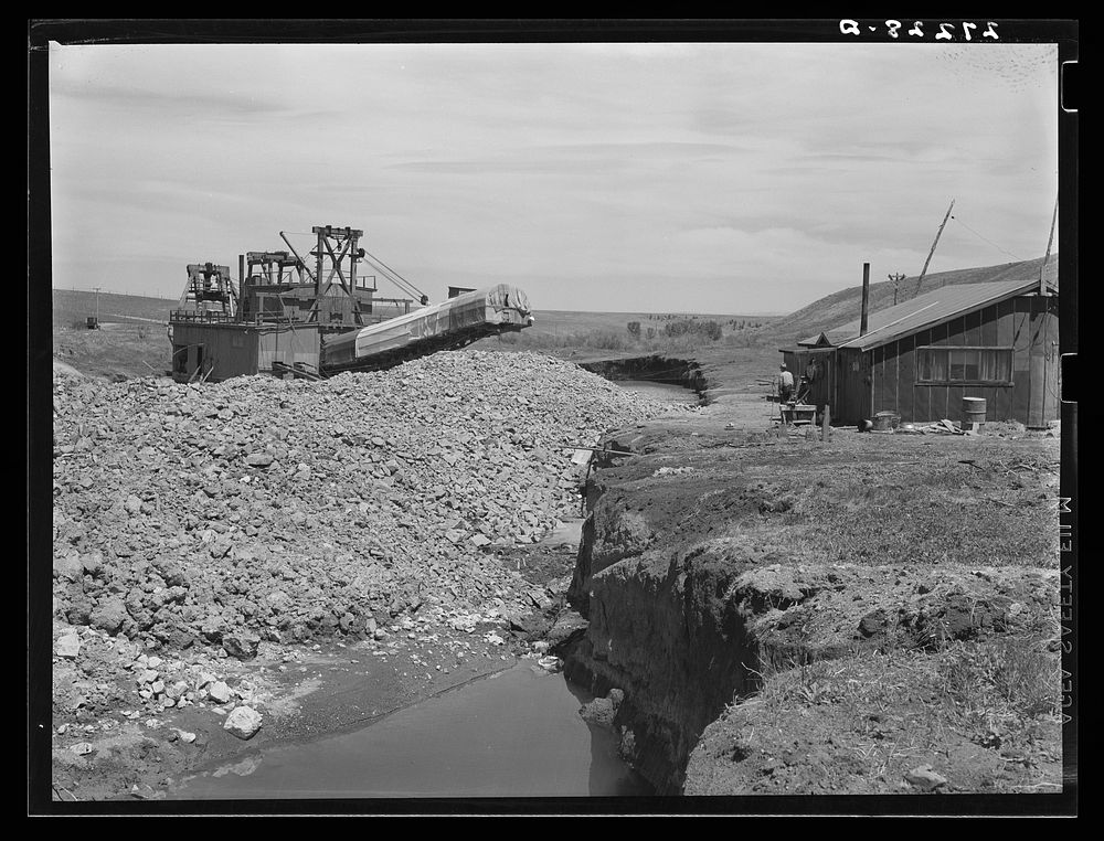 Tailing piles left by gold dredge. Madison County, Montana. Sourced from the Library of Congress.