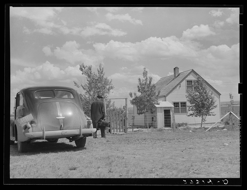 Doctor hired by farmers' cooperative health association. Fairfield Bench Farms, Montana. Sourced from the Library of…