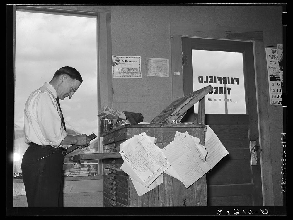 Editor of Fairfield Times setting type. Fairfield. Montana. Sourced from the Library of Congress.