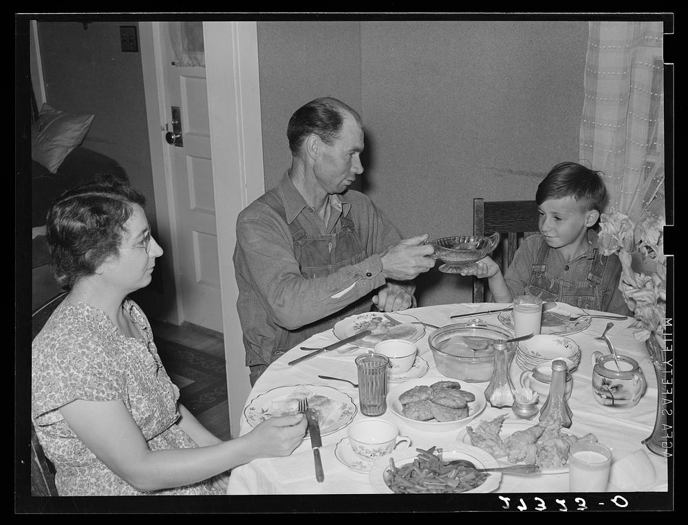 Farm family at dinner. Fairfield Bench Farms, Montana. Sourced from the Library of Congress.
