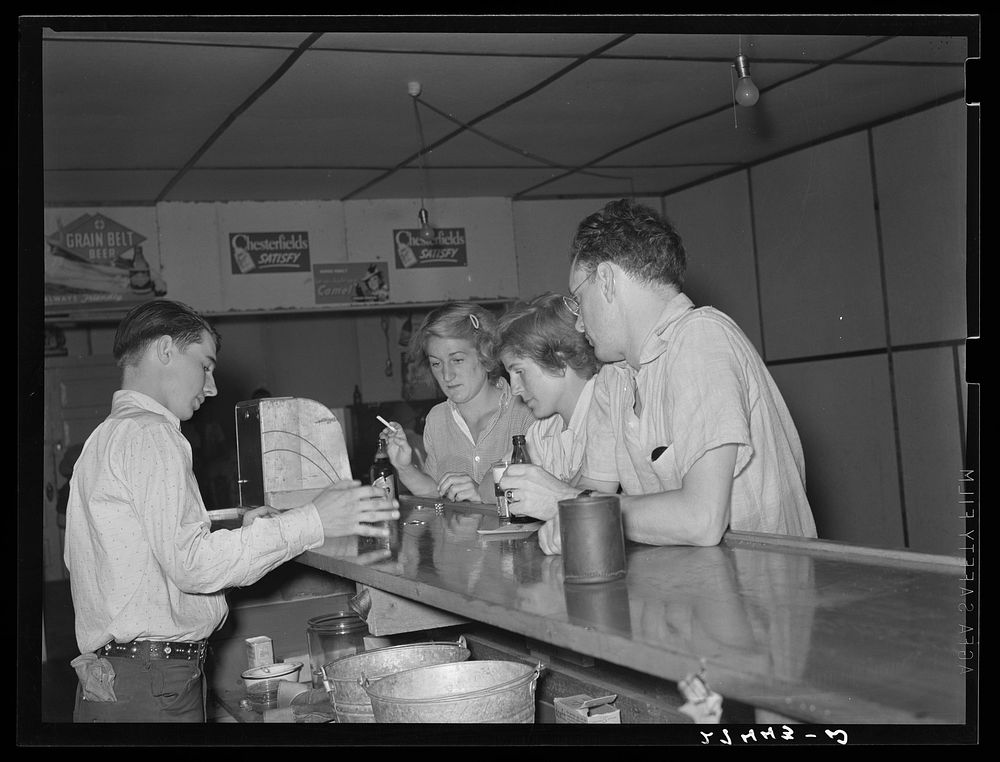 Dudes gambling at bar. Birney, Montana. Sourced from the Library of Congress.