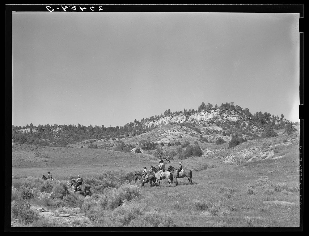 [Untitled photo, possibly related to: Dudes out for a morning ride. Quarter Circle 'U' Ranch, Montana]. Sourced from the…
