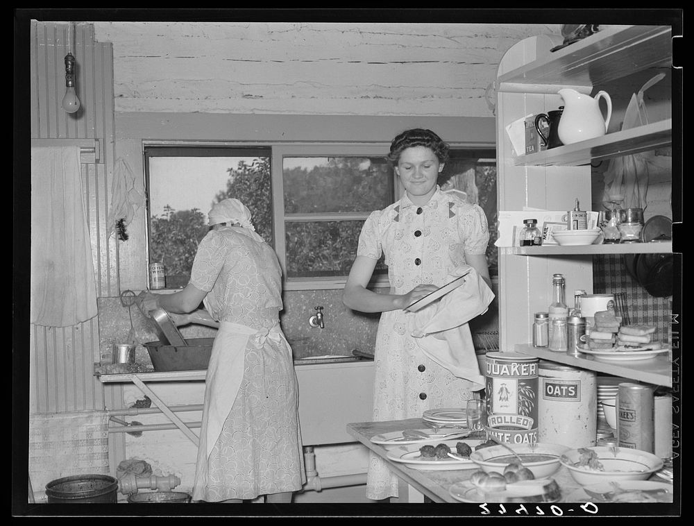 Cook and hired girl. Quarter Circle 'U' Ranch, Montana. Sourced from the Library of Congress.