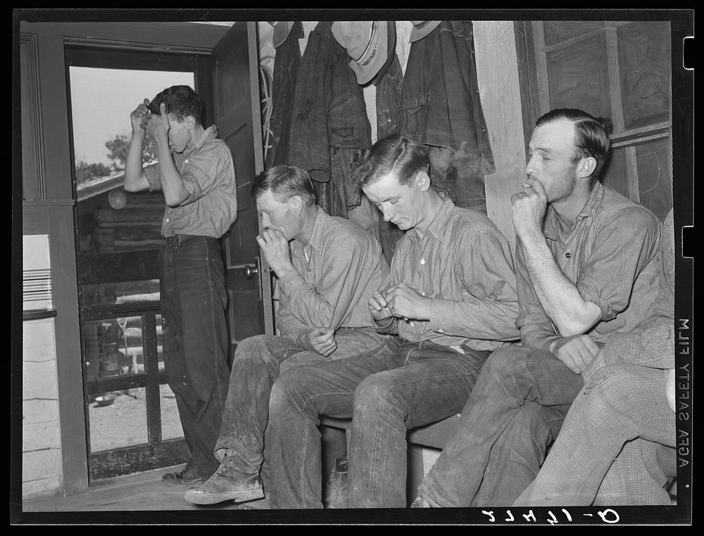 Cowhands waiting for call to dinner. Quarter Circle 'U' Ranch, Montana. Sourced from the Library of Congress.
