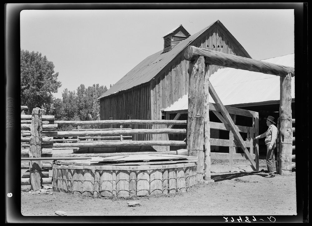 Corral gate and watering trough. Quarter Circle 'U' Ranch, Montana. Sourced from the Library of Congress.