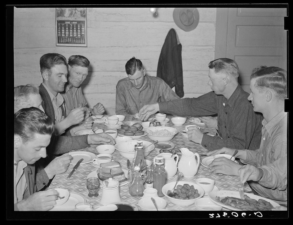 [Untitled photo, possibly related to: Cowhands at dinner. Quarter Circle 'U' Ranch, Montana]. Sourced from the Library of…
