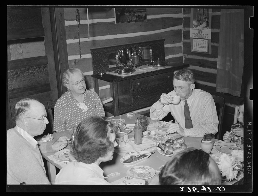 Mr. and Mrs. Jack Arnold, ranch owners, at dinner. Quarter Circle 'U' Ranch, Montana. Sourced from the Library of Congress.