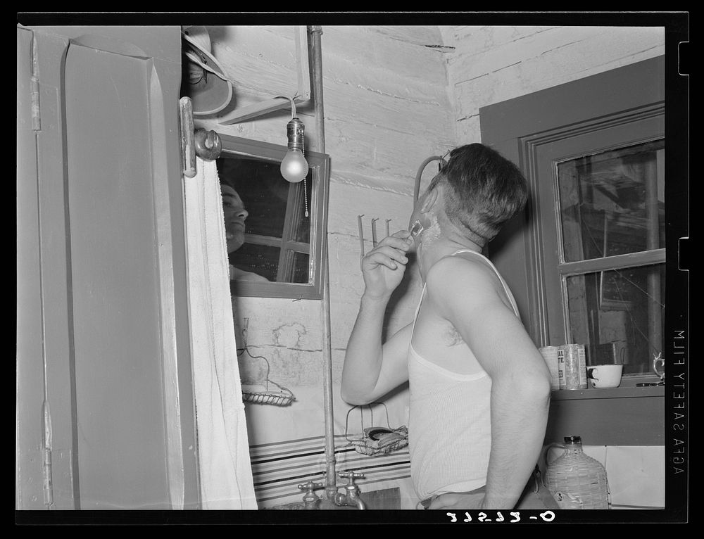 Cowhand shaving. Quarter Circle 'U' Ranch, Montana. Sourced from the Library of Congress.