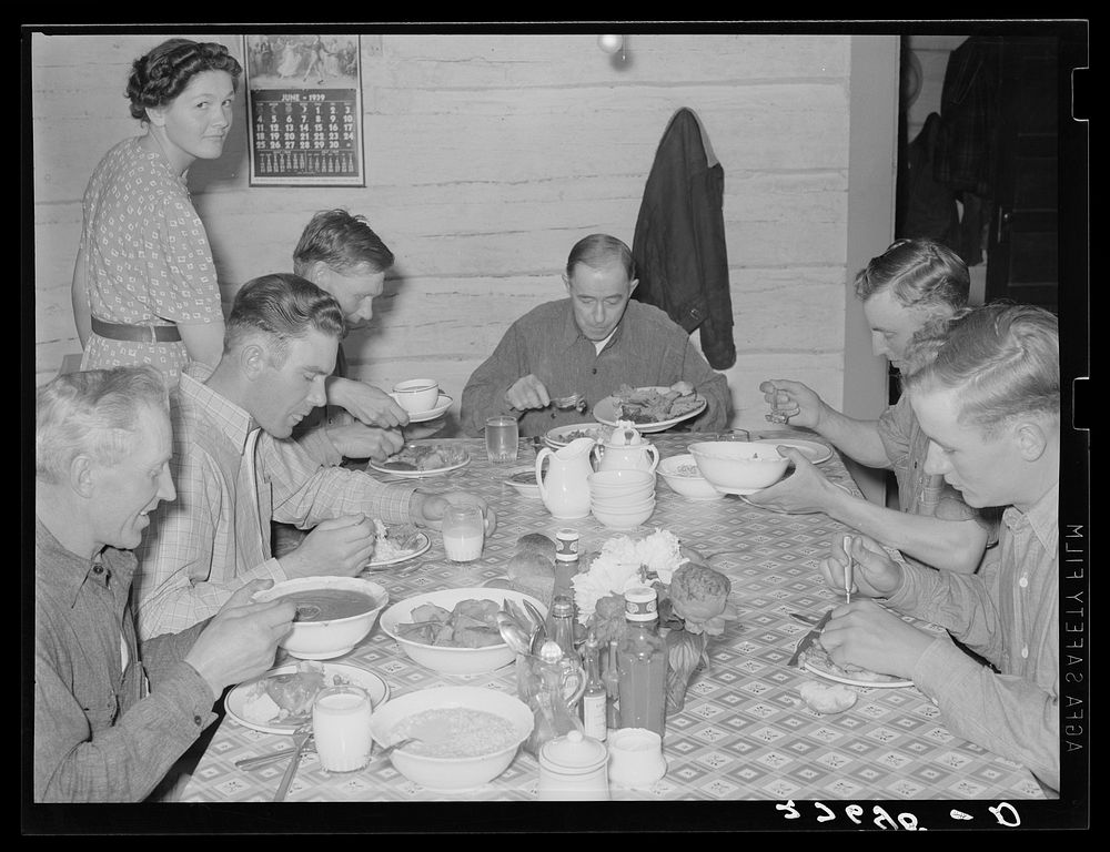 [Untitled photo, possibly related to: Cowhands at dinner. Quarter Circle 'U' Ranch, Montana]. Sourced from the Library of…