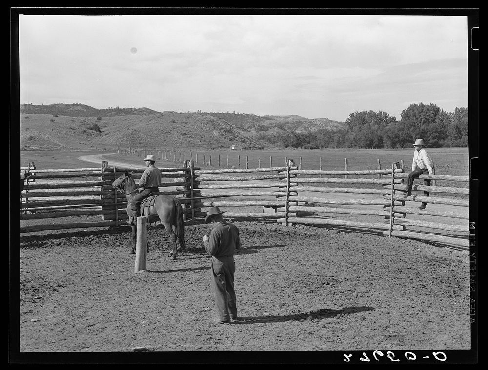 [Untitled photo, possibly related to: Giving directions to visiting cowhand. Quarter Circle 'U' Ranch, Montana]. Sourced…