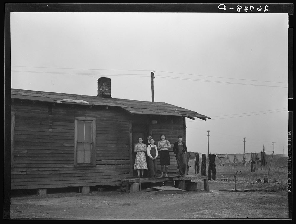 Miner's children on porch of their home. Zeigler, Illinois. Sourced from the Library of Congress.