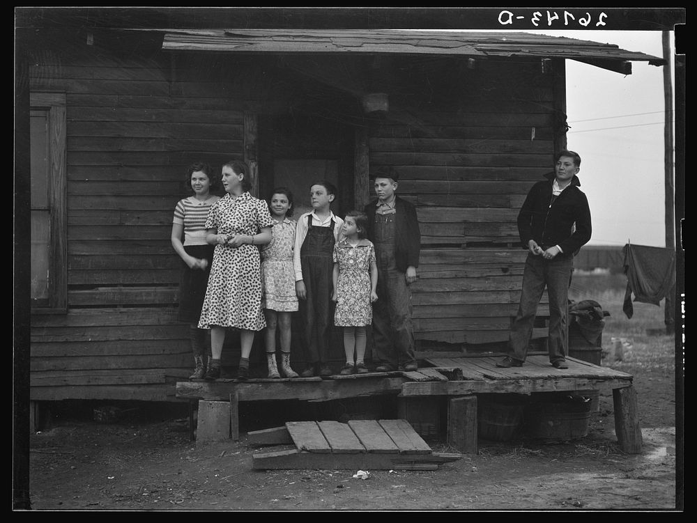 [Untitled photo, possibly related to: Miner's children on porch of their home. Zeigler, Illinois]. Sourced from the Library…