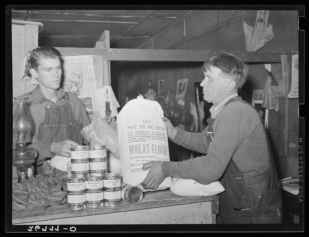 Unemployed miner with food from surplus commodities corporation. Zeigler, Illinois. Sourced from the Library of Congress.