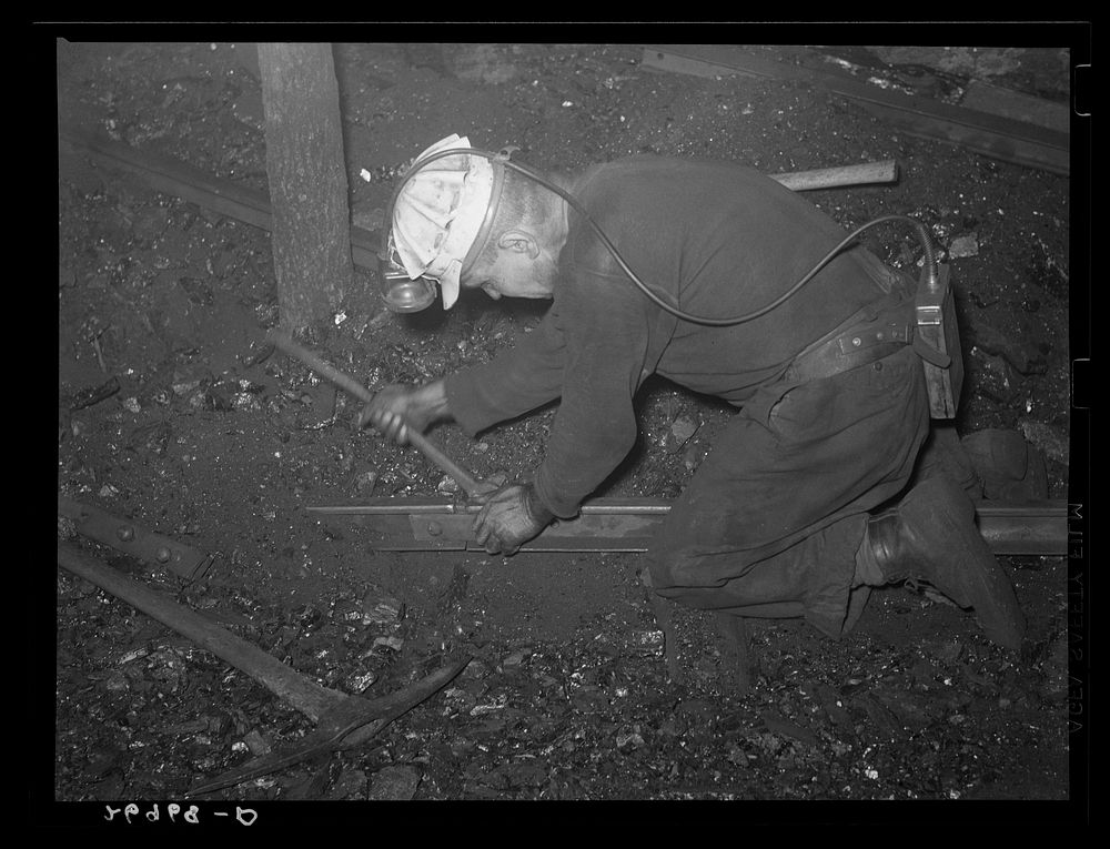 Laying track underground. Old Ben number eight mine. West Frankfort, Illinois. Sourced from the Library of Congress.