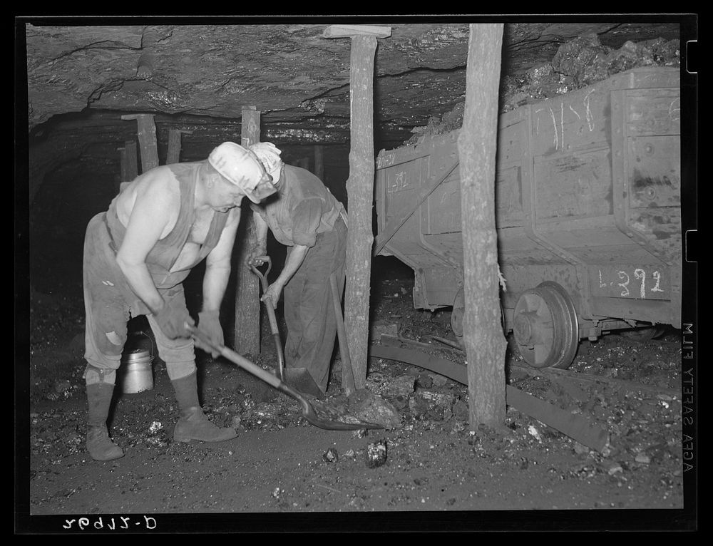 Hand loading into a pit car. Old Ben number eight. West Frankfort, Illinois. See 26980-D. Sourced from the Library of…