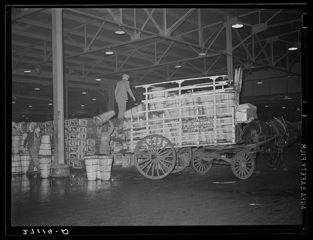 Commission buyer loading crates of cabbage at produce market. Pier 29, New York City. Sourced from the Library of Congress.