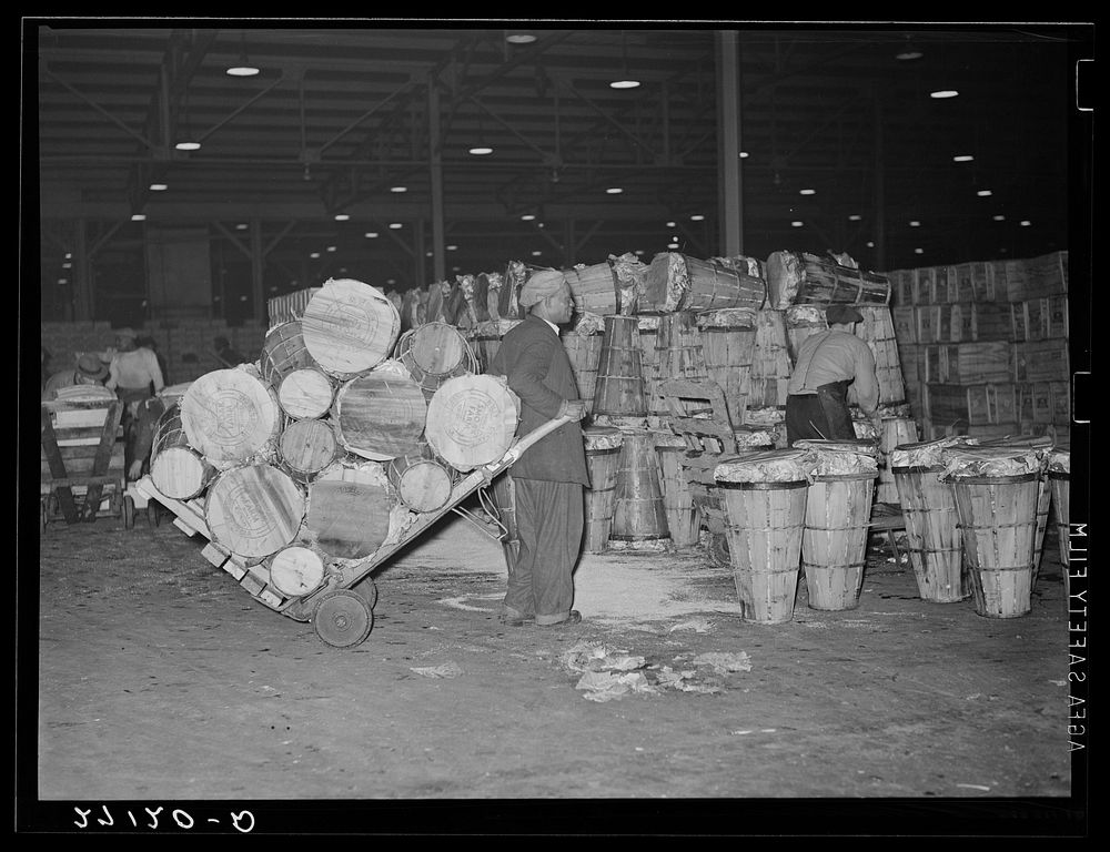 Unloading crates of cabbages at produce market. Pier 29, New York City. Sourced from the Library of Congress.