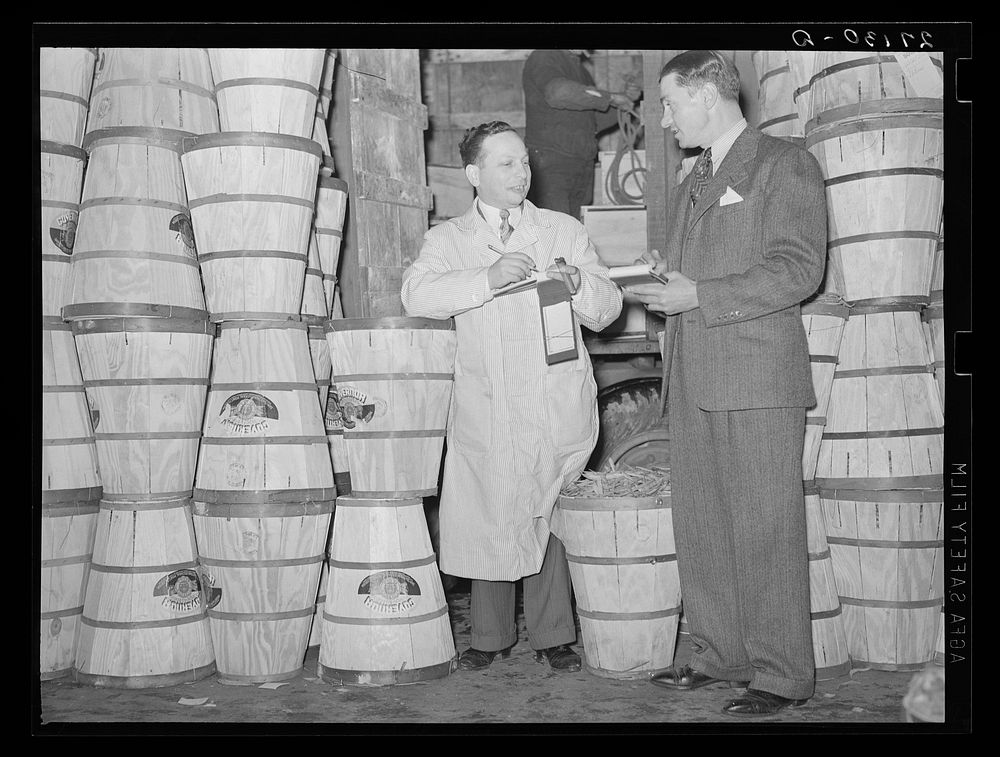 Commission merchants at Washington Market, New York City. Crates contain beans. Sourced from the Library of Congress.