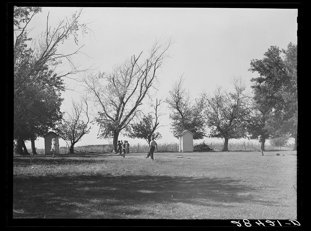 Children playing during recess. Grundy County, Iowa. Sourced from the Library of Congress.