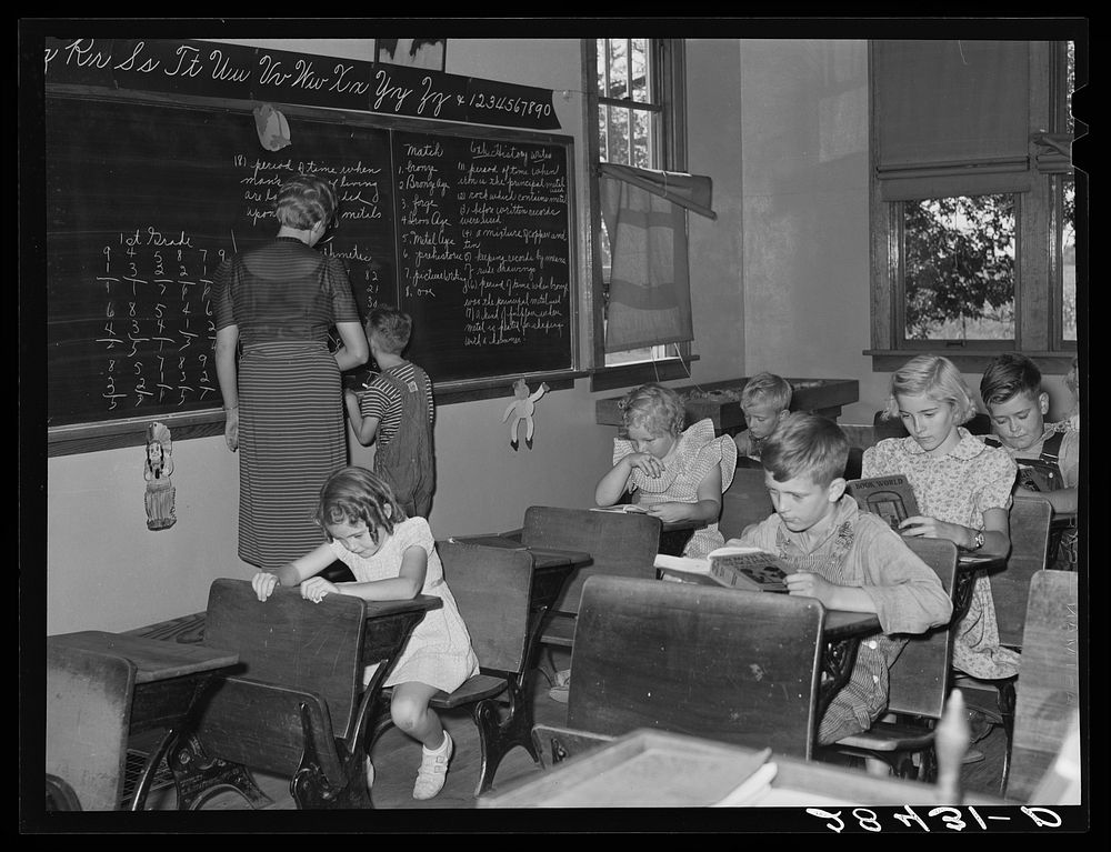 Teaching only pupil in the second grade in one-room schoolhouse. Grundy County, Iowa. Sourced from the Library of Congress.