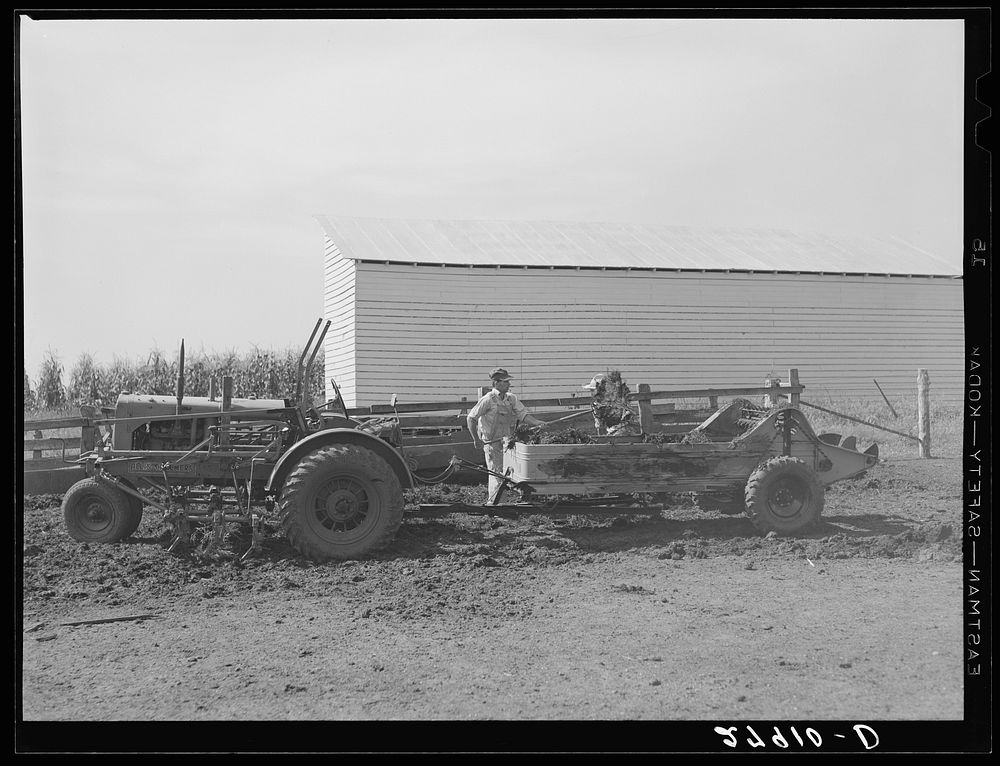 [Untitled photo, possibly related to: Spreading manure. Kimberley farm, Jasper County, Iowa]. Sourced from the Library of…