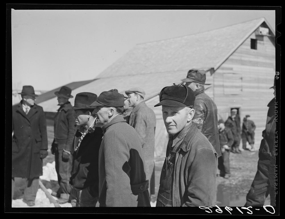 [Untitled photo, possibly related to: Farmers at Zimmerman auction near Hastings, Nebraska]. Sourced from the Library of…