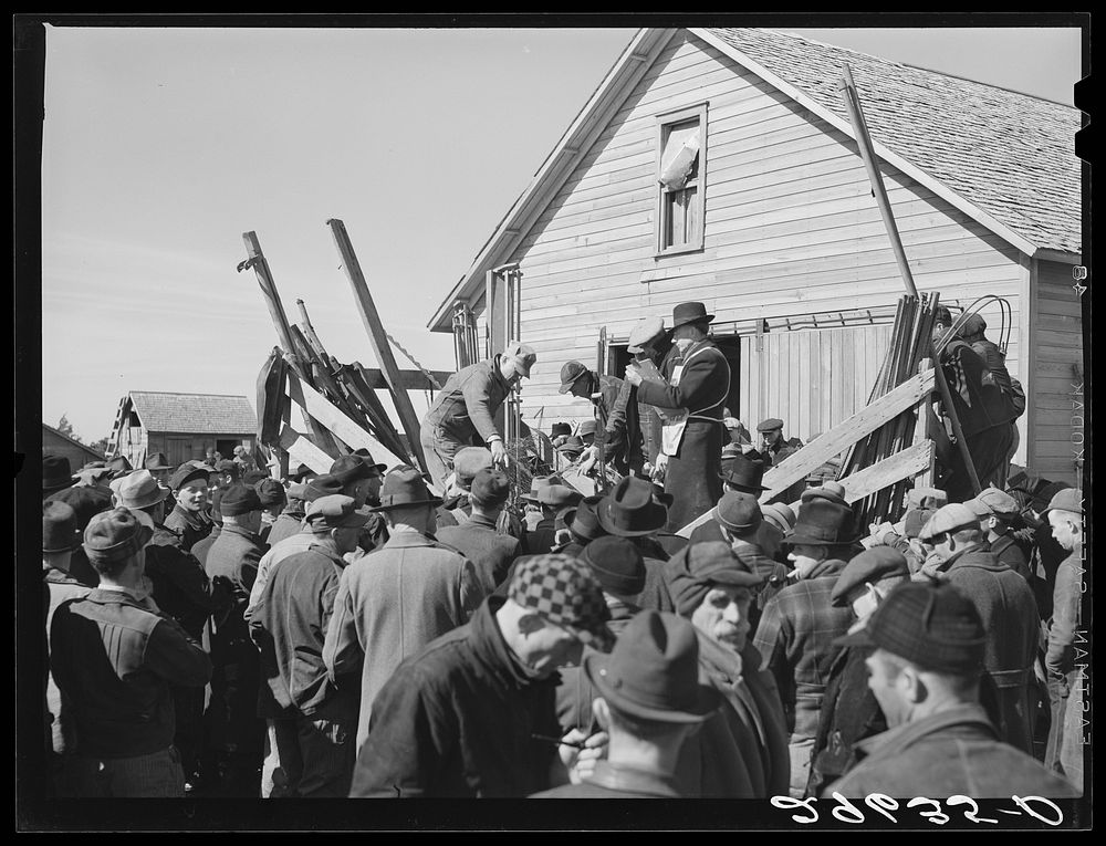 [Untitled photo, possibly related to: Auctioning farm equipment at Zimmerman farm near Hastings, Nebraska]. Sourced from the…