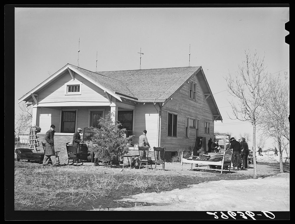 Furniture to be auctioned is displayed around P.C. Zimmerman's house near Hastings, Nebraska. Sourced from the Library of…