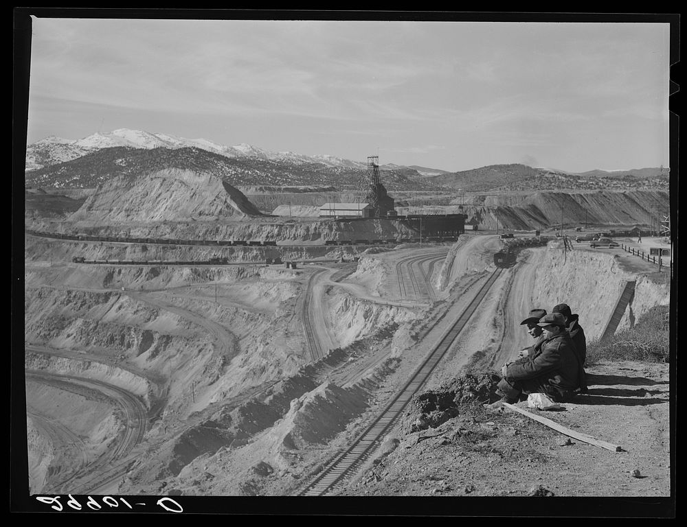 Workers sitting at edge of copper pit. Ruth, Nevada. Sourced from the Library of Congress.