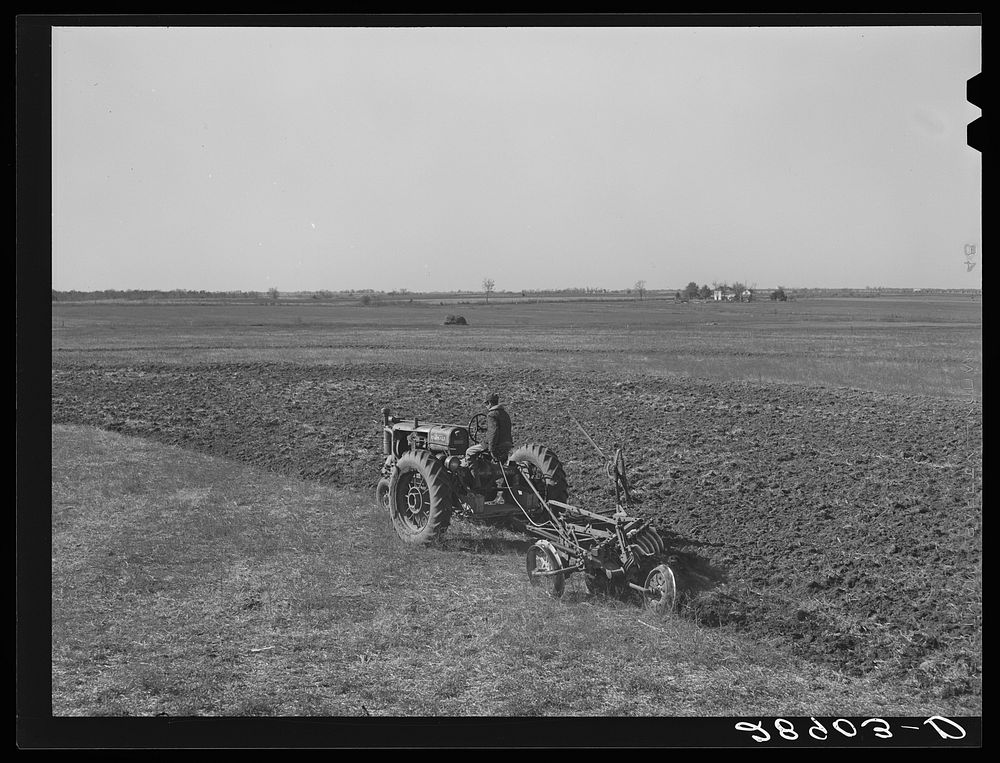 Large scale farming with tractors means greater profits on the Bois d'Arc cooperative. Osage Farms, Missouri. Sourced from…