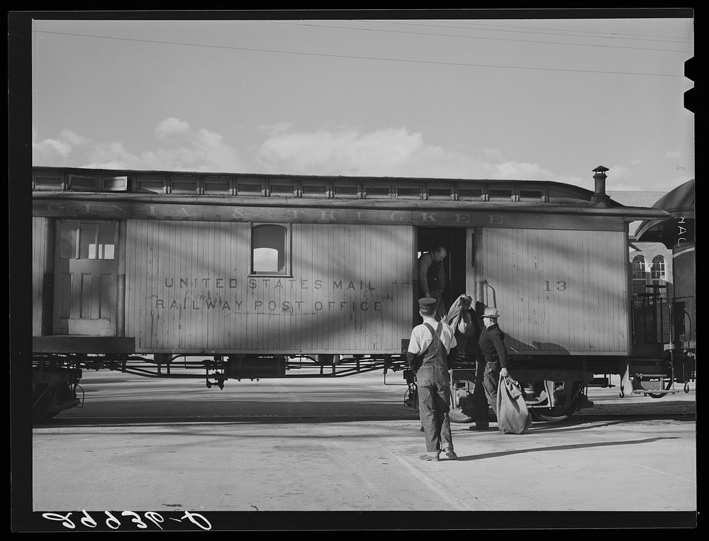 Loading mail into railroad car. Carson City, Nevada. Sourced from the Library of Congress.